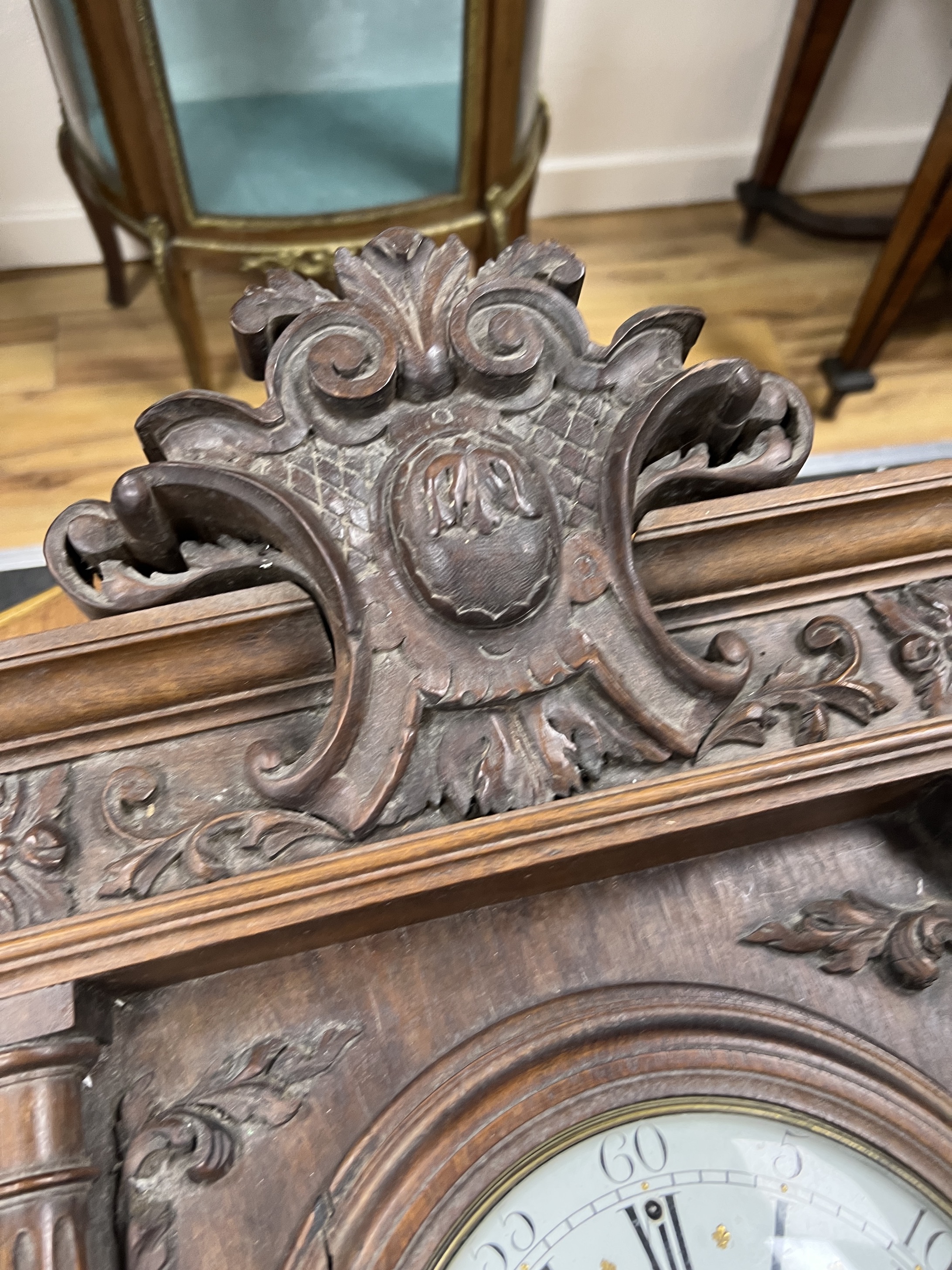 A late 19th century French carved walnut wall clock combined thermometer and barometer, dial and movement marked J Baptiste Baillon, Paris, height 93cm